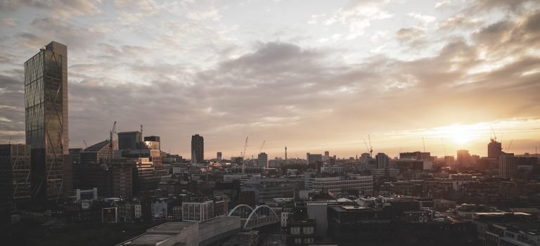 The London skyline at sunset, looking across the City rooftops